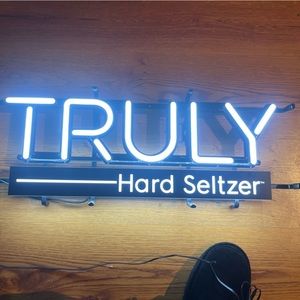 Brand new, never used, truly hard seltzer neon plug in sign.